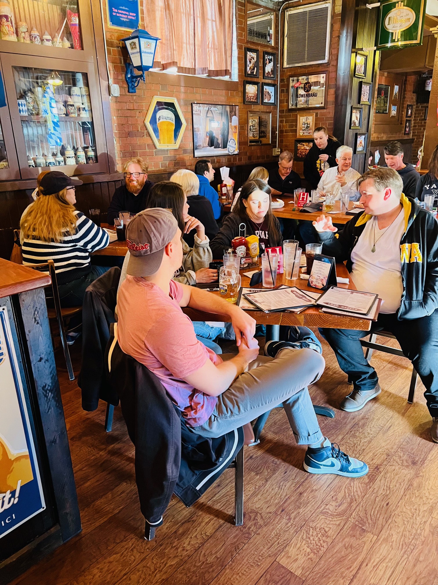 Harvard Club of Iowa members sitting together and chatting in a bar